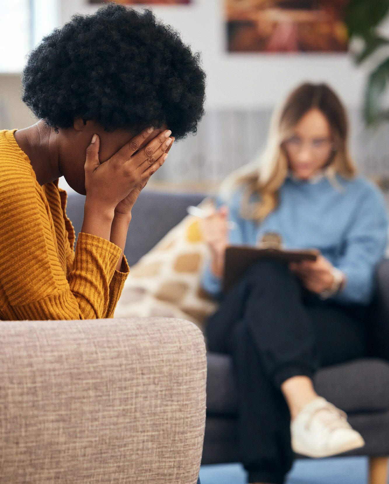 Mental health, stress and psychology with a black woman in therapy, talking to a professional. Anxi