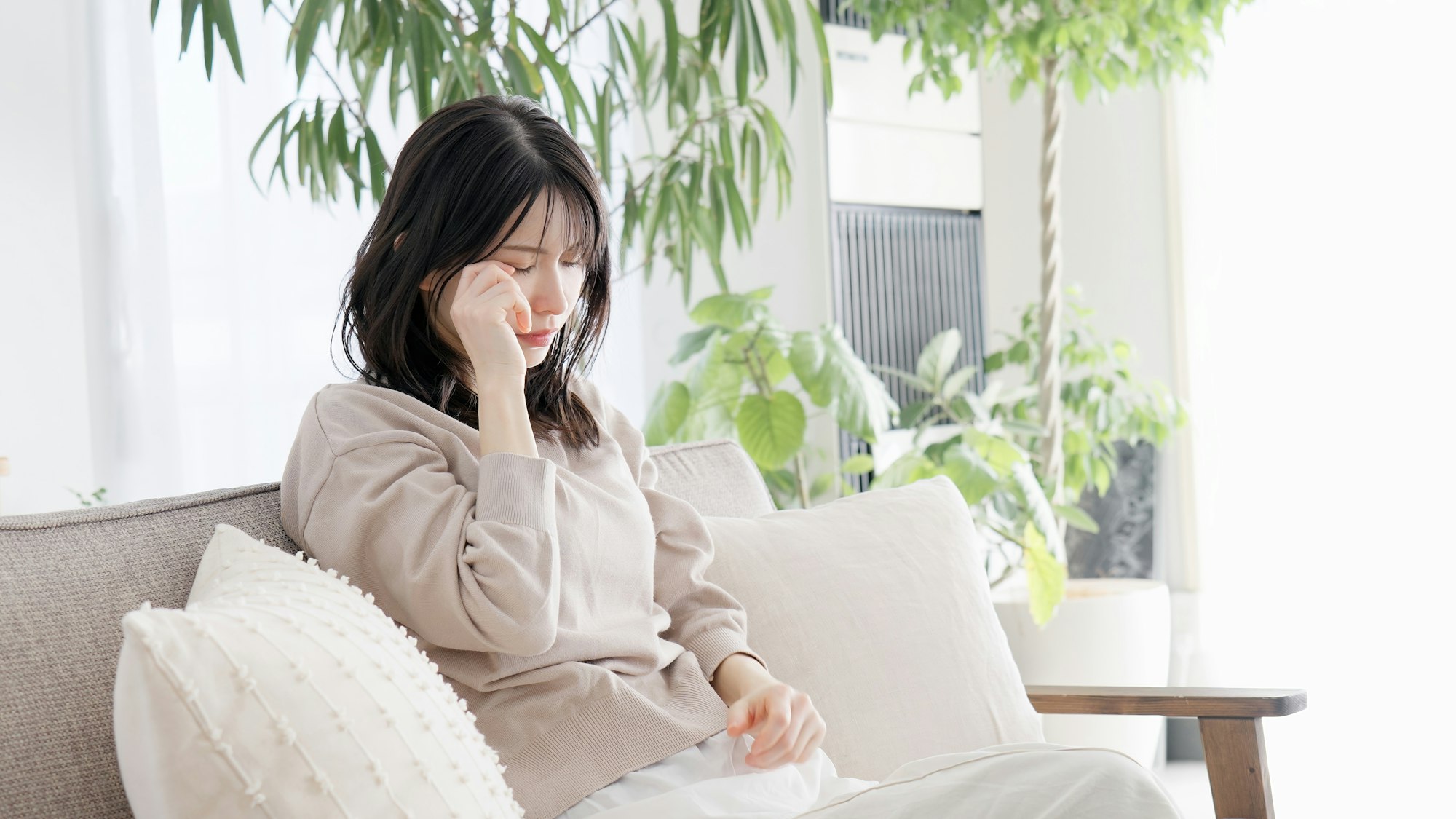 Woman crying in the living room